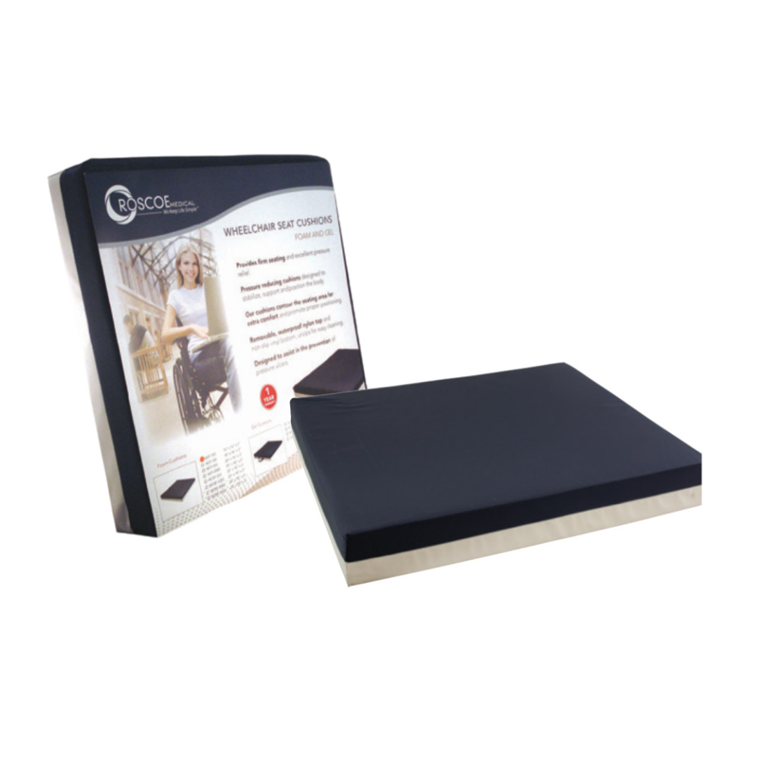The Roscoe Medical Foam Wheelchair Cushion with Nylon Cover, shown in black beside its packaging, features pressure ulcer prevention. The box displays product details and an image of a person in a wheelchair against a white background.